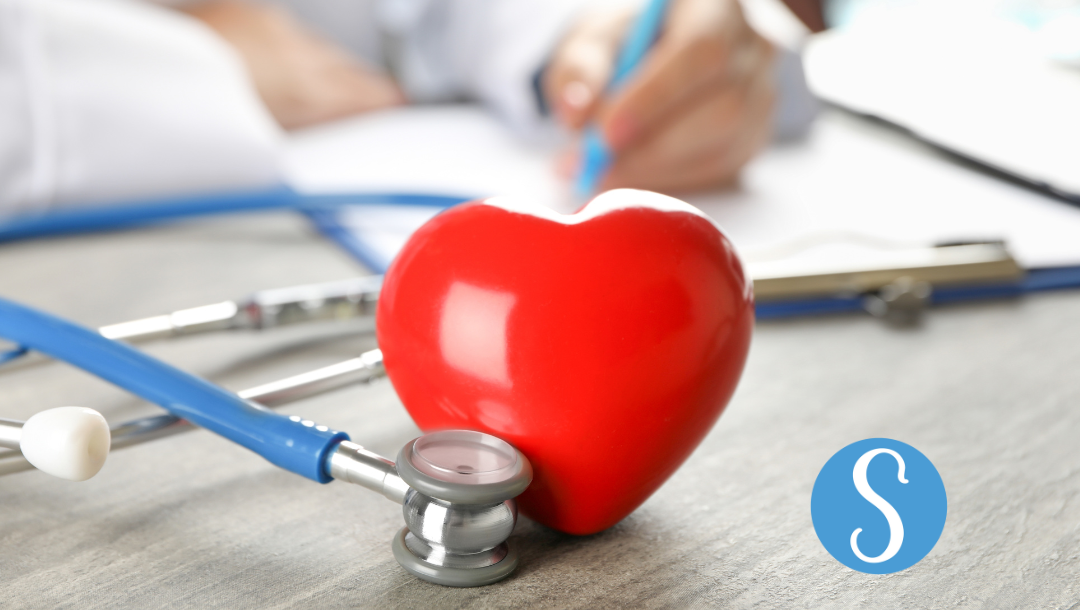 A heart shaped object next to a stethoscope