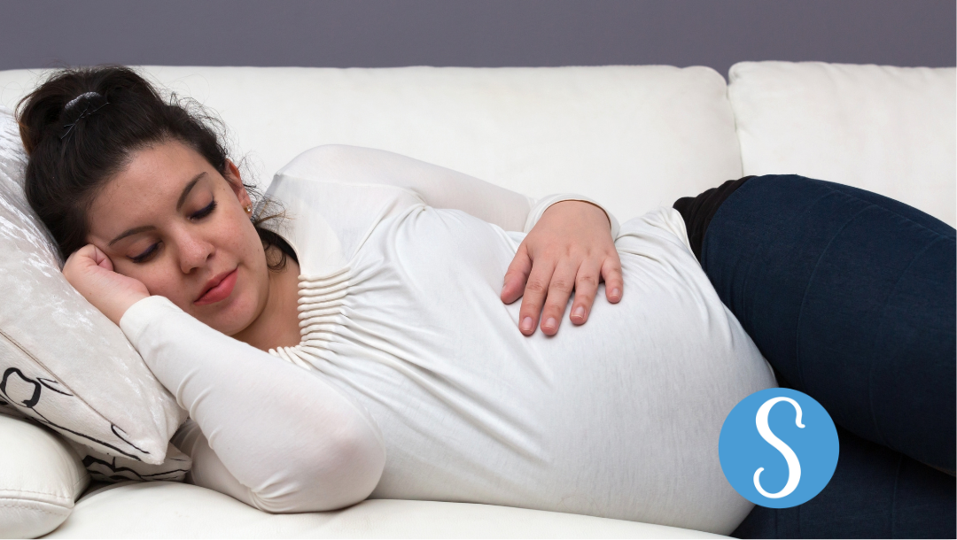 A pregnant woman sleeping