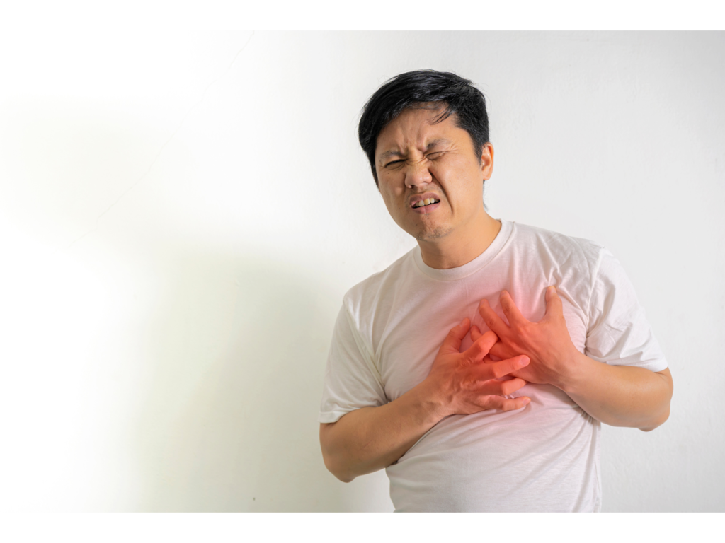 Asian man clenching painful chest