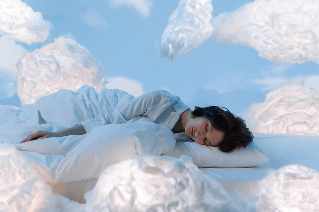 Asian woman sleeping on her left sides in the clouds