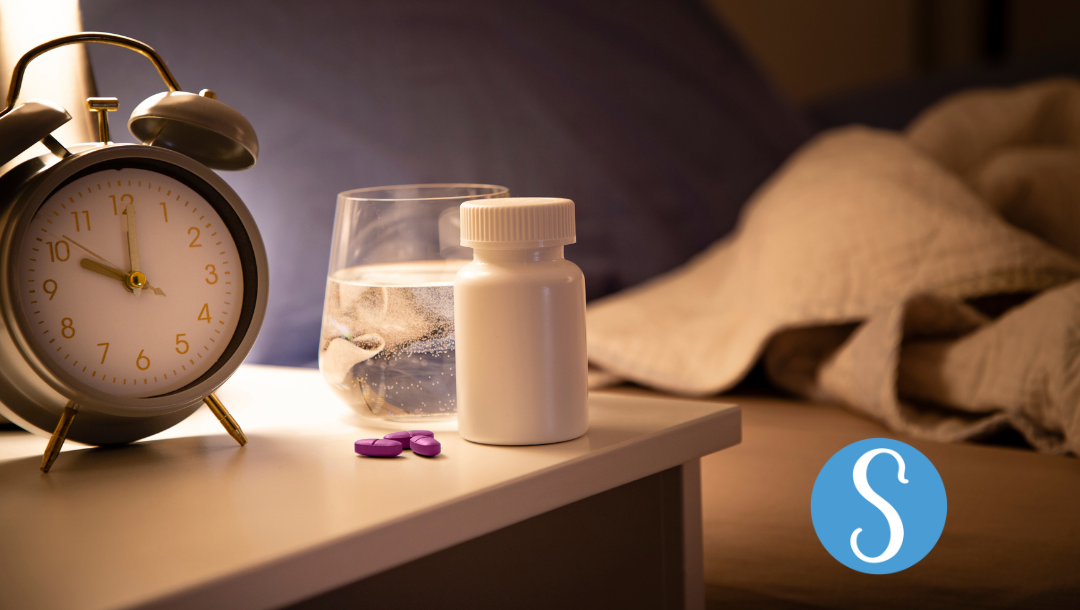 Sleeping aids on a bedside table.
