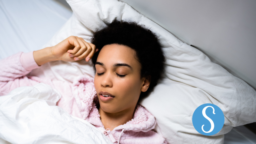 A woman sleeping in bed