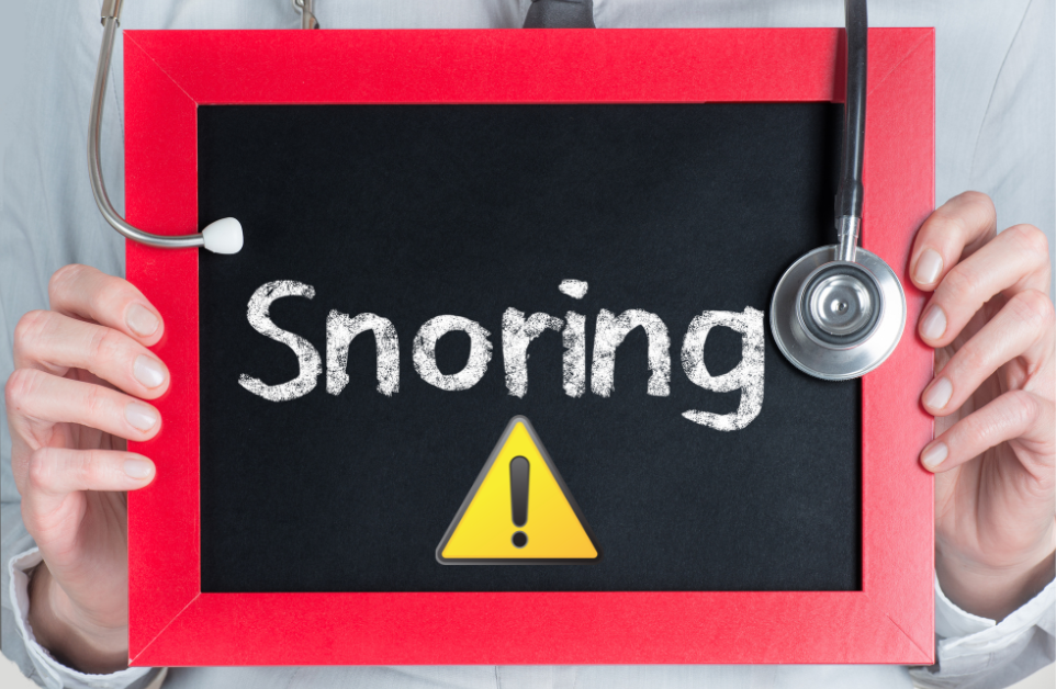 A chalk board with the word "snoring" and a hazard sign.