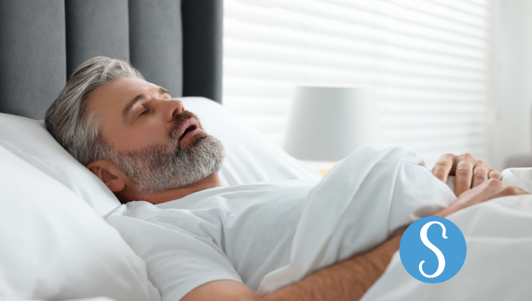 A man snoring while lying on his back