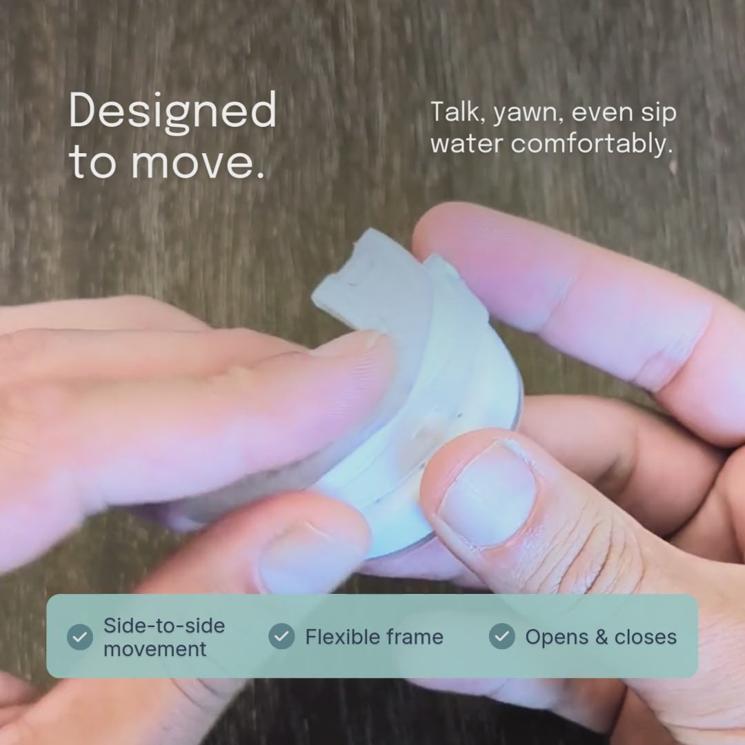 Hands opening and closing a clear Somnofit-S mouthpiece to show its flexible frame